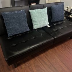 Black leather reclining loveseat