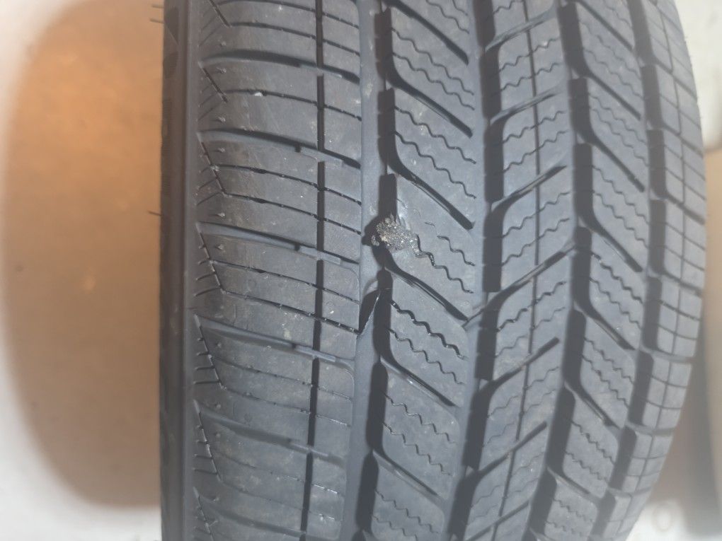 Bridgestone In Good Condition Has A Plug In It Hose Air 215 50 18.   75% Tread