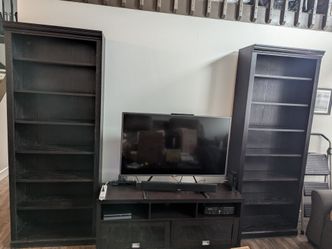 Two bookshelves and a tv stand