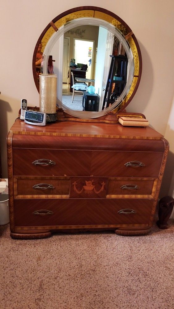 Waterfall dresser with deco mirror, chest of drawers,  and armor 