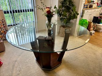 Espresso colored dining table with glass top