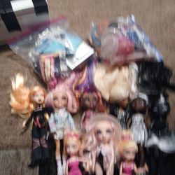 Rainbow And Monster High Dolls