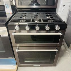 KitchenAid natural gas stove. Stainless steel, double oven, one receipt for a 60-day warranty.