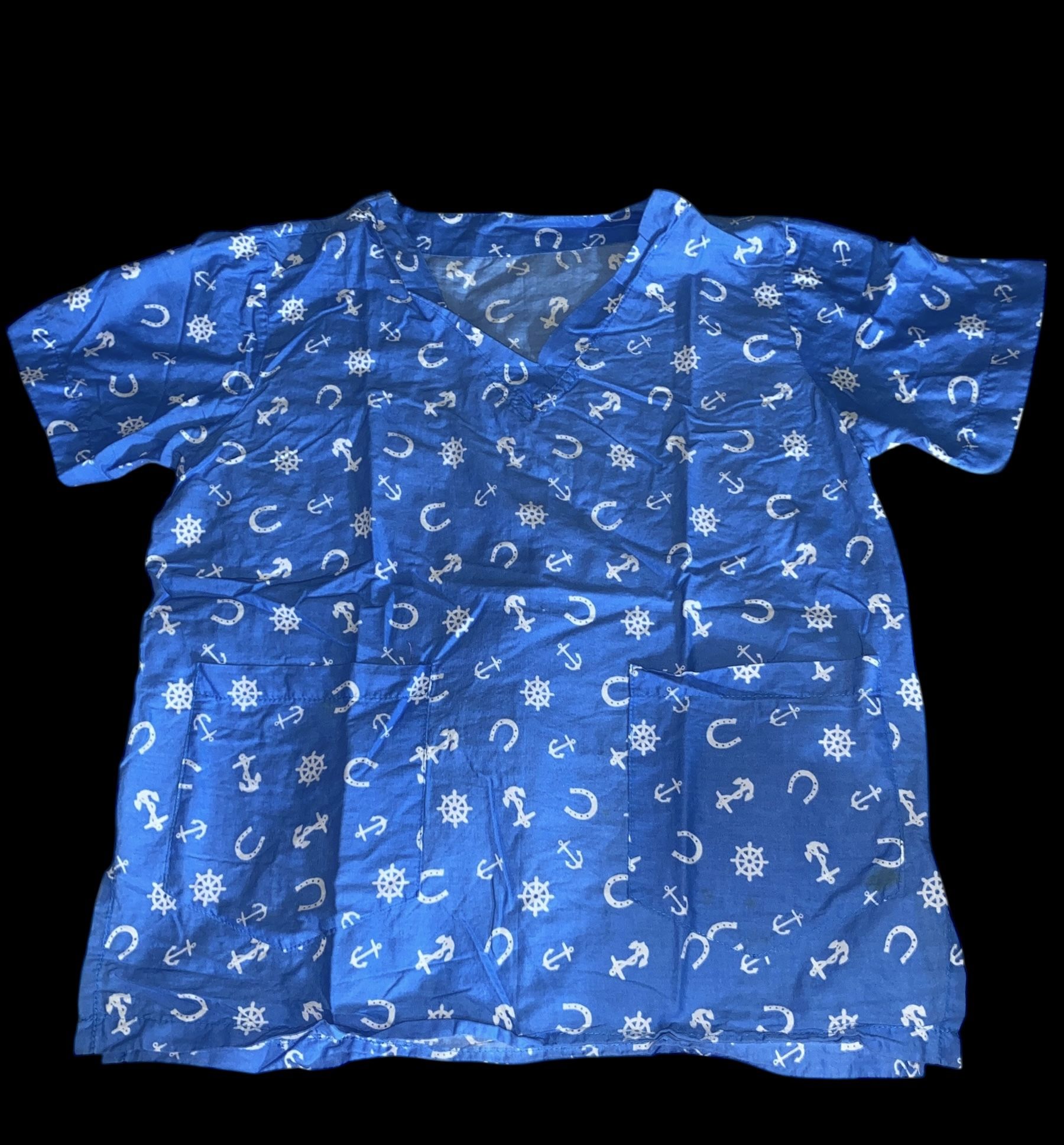 Blue scrub top with a pattern of white anchors, horseshoes, and ship wheels
