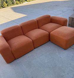 The 84.6 inch Orange Teddy Fleece Creative Sofa can be Assembled into a Two Seater Sofa