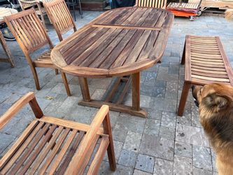 Gloster Teak Brand oval extending teak table with 4 matching chairs and a bench Located in concord Fair Recently cleaned, sanded and teak oiled Teak