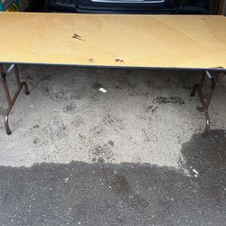 6’ x 30" Wood Banquet Table the laminate on top was peeled off