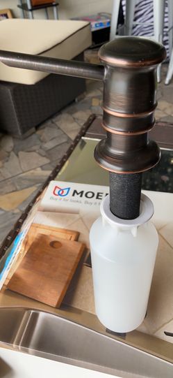 Moen/Soap/Lotion Dispensers In Rubbed Bronze.