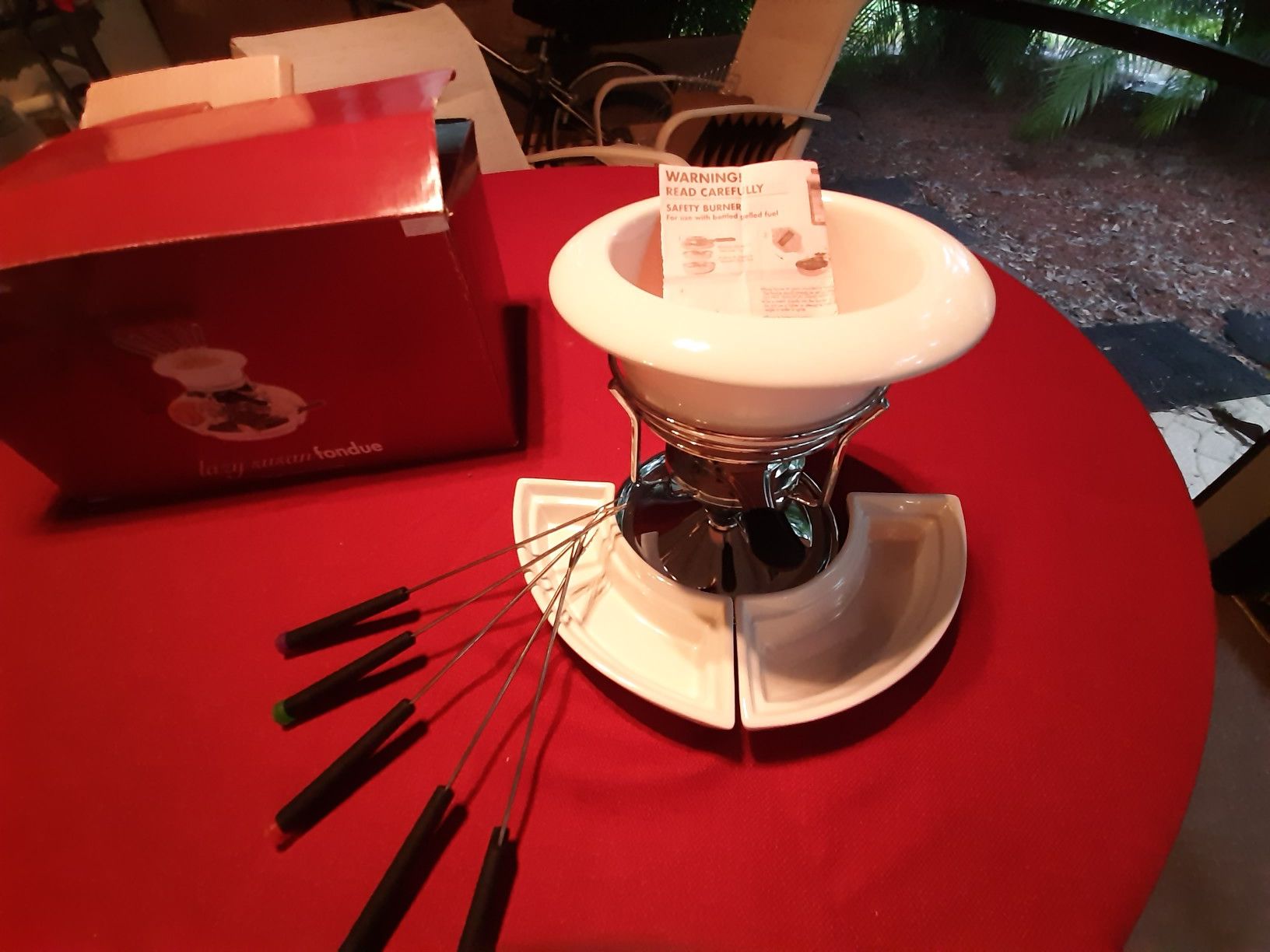 Fondue warmer with side plates and forks. New