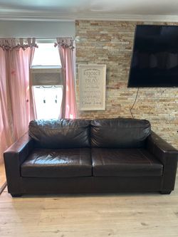 Brown leather couch bed