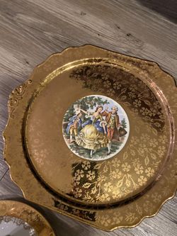 13 piece gold plated plate set. Very rare and eye catching.