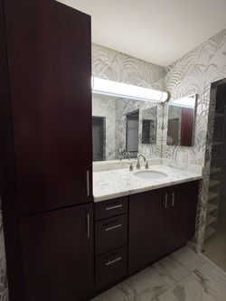Vanity with cabinet door organizer with wire baskets