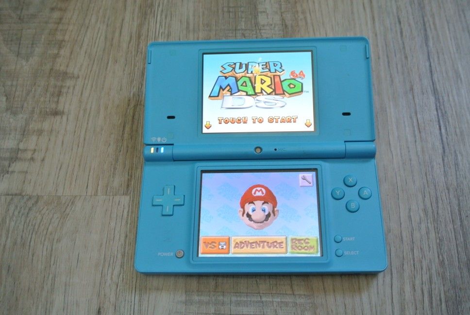 Nintendo DSi Light Blue Handheld Console Game System with charger and case