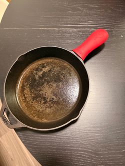 Lodge Cast Iron Skillet with Red Silicone Handle