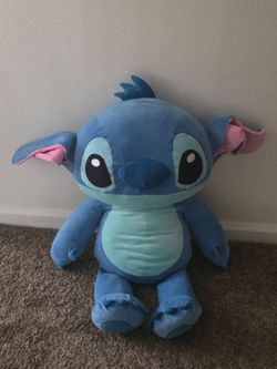 A Large Blue Disney Stitch plush toy