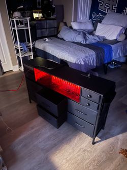 Amazing deal Like new Black dresser with LED lights 6 drawers and 4 small drawers 50”length 30” high