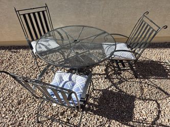 Patio  table, 3 chairs and umbrella stand.
Delivery available.
