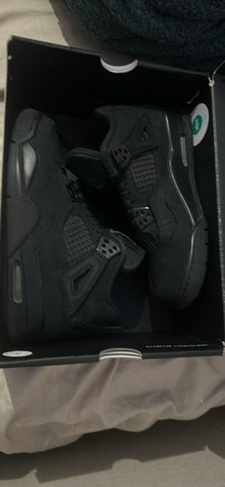 Black cat Jordan 4s