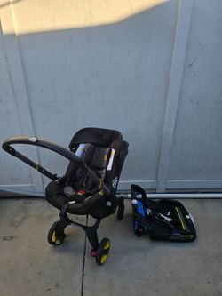 Doona Infant Car Seat Stroller with Base
