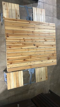 Portable 4-person folding wooden picnic table set.
