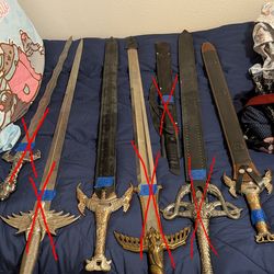 Lot of decorative swords, military sabers and katana's