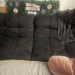 Black futon with adjustable arms