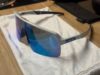 Oakley Sutro lite special spec white frame prism blue lens with matching Oakley stem emblems