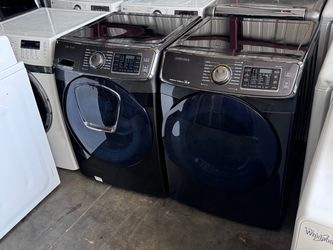 Black stainless front load Samsung washer and dryer electric high efficiency working perfectly.extra for delivery same day delivery and installation a