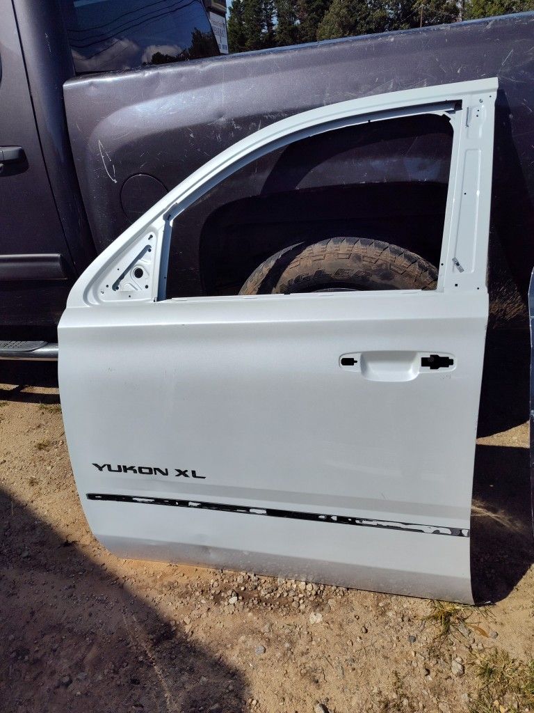 Driver Side Front Door For A 2015 To 22 GMC Yukon Or Tahoe / Suburban Doors Are The Same Original OEM Part
