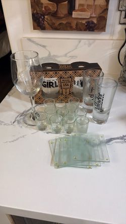 4 LOVE coasters, 2 tall shot glasses, 11 small shot glasses, and 2 wine tumbler, 1 wine glass. All for $15.