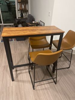 Side table with three bar chairs