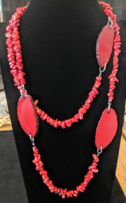 $8. Red coral necklace. 42 inches. The 3 flat red stones are 2.25 inches long.