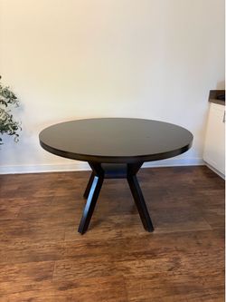 Round wooden dining table