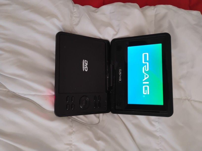Craig DVD player Comes With Charger And Movies Asking 25$
