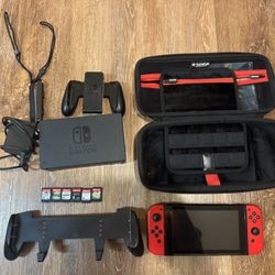 Nintendo Switch 1 Gen 2 with Case, Grip, And Games
