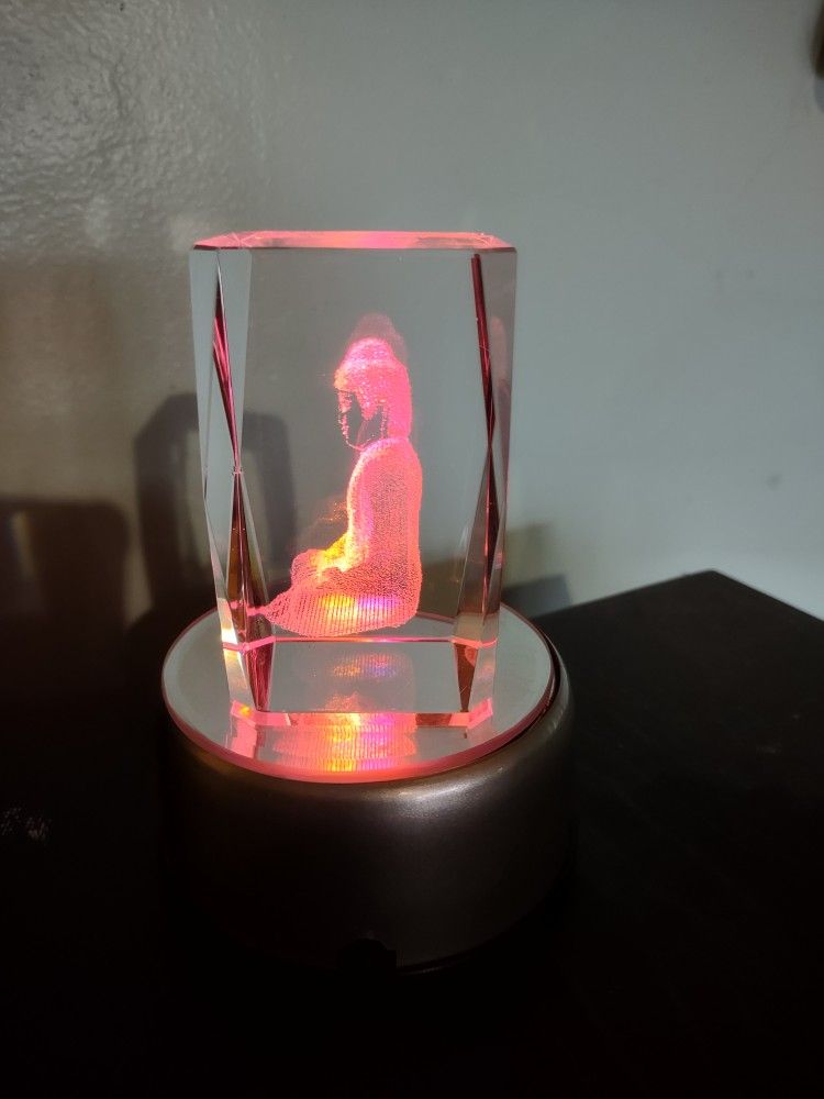 Rotating, laser-edged acrylic Buddha