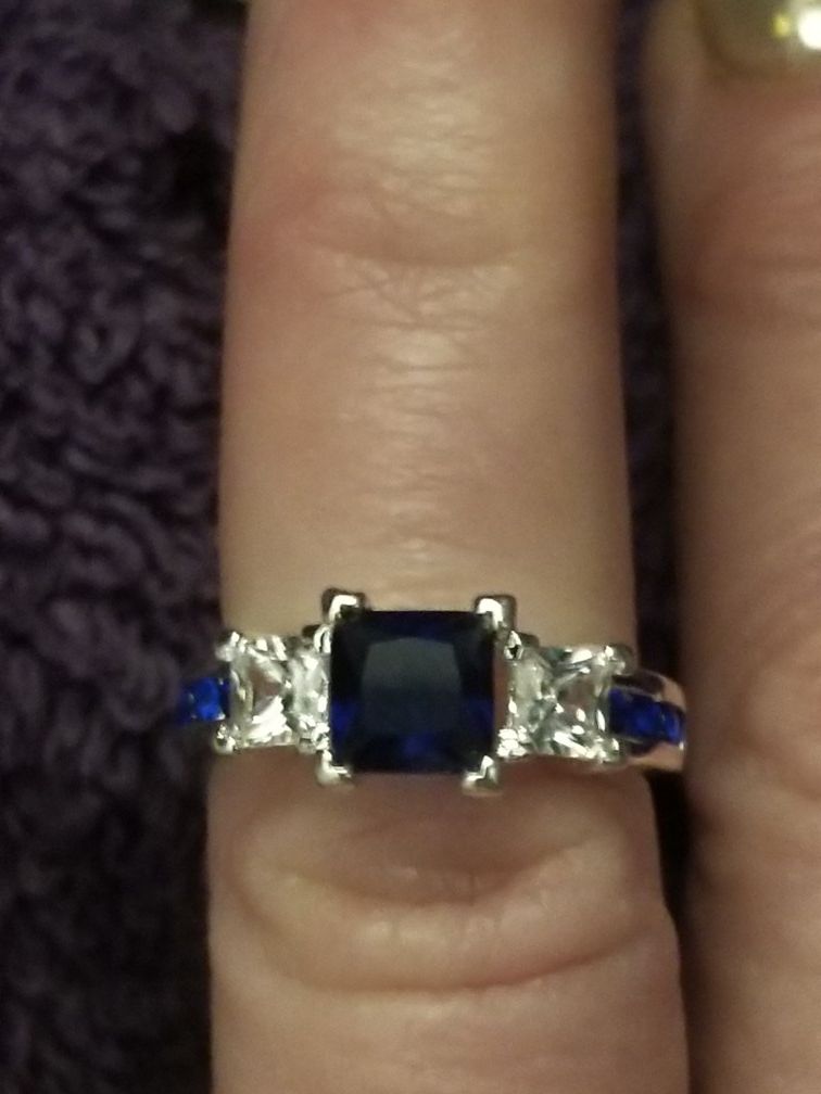 Beautiful 925 silver ring with white cz's and blue sapphires. Size 6.