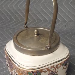  TEA CADDY, MADE IN ENGLAND WITH SILVER HANDLE, RIM AND LID