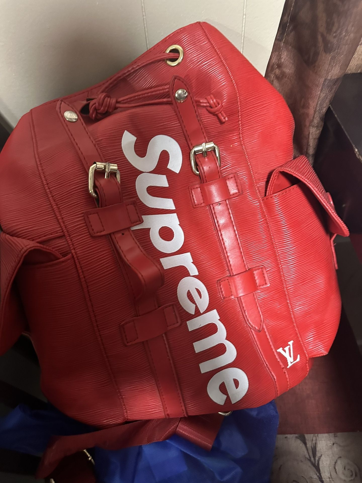 Supreme bookbag red sale