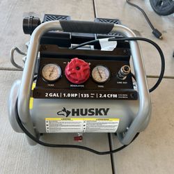 Husky 2 Gal. 135 PSI Portable Electric Oil-Free Quiet Jobsite Air Compressor with Dual Pressure Gauges and 1-Quick Coupler