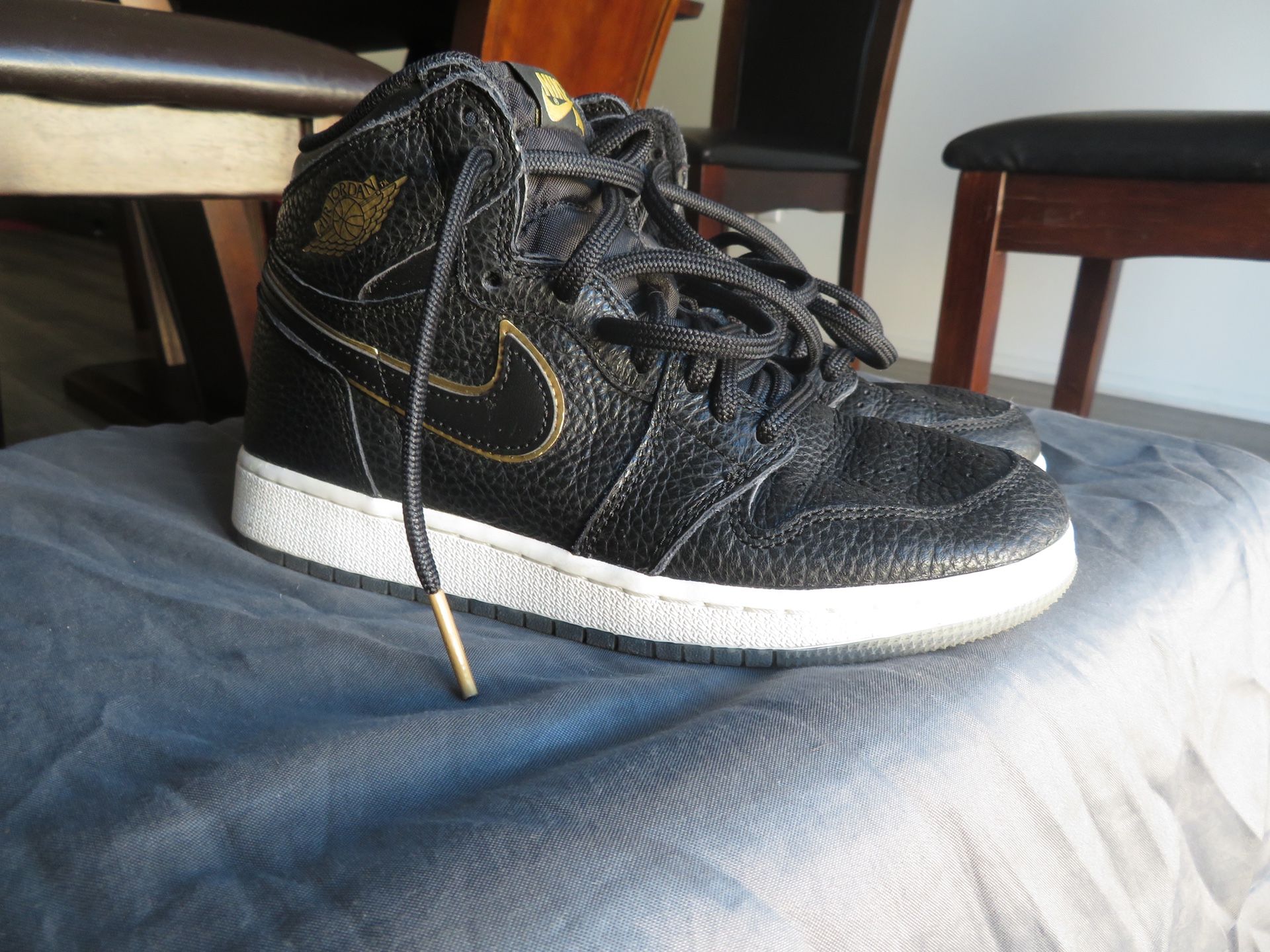 Black and Gold Jordan 1s