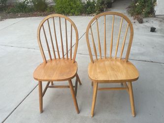 Two wooden dining chairs