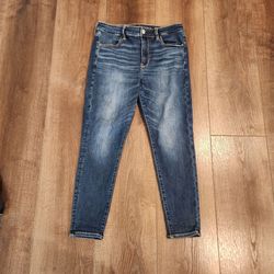 American Eagle NE(X)T LEVEL STRETCH jeans feature a dark wash denim finish with contrast stitching, size 12 short, good condition