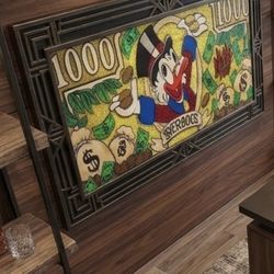 Like New Scrooge McDuck $1000 bill Mike Mozart Art Layered with metal flake, and protected under a luminescent resin finish on a 20 inch X 49 inch can