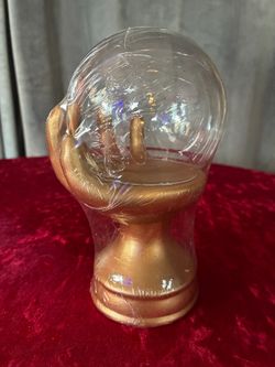 Gold Hand Holding Crystal Ball Snow Globe