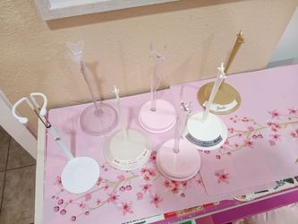 Barbie doll stands 7 total ....$5 takes all of them as a set ....not 5 each.....$5 takes all of them ...some from barbie collector dolls