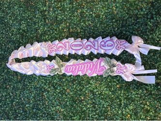 Pink grad lei