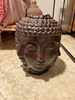 Buddha face vase