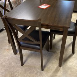 Brand new table and four chairs $450
