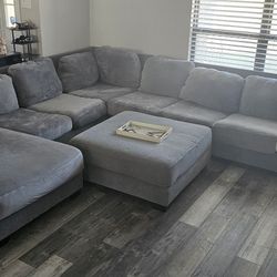 Oversized Large Sectional + Ottoman. Seats 8 people comfortably and is Modular